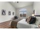 Cozy primary bedroom features modern decor with wood floors and neutral colors at 4043 E Geddes Cir, Centennial, CO 80122