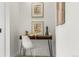 Cozy nook featuring a modern desk, white chair, and artwork for a creative space at 4043 E Geddes Cir, Centennial, CO 80122