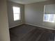 Bedroom with carpet, neutral walls, and two windows at 4482 S Ukraine Ct, Aurora, CO 80015