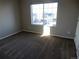 Large bedroom with carpet, neutral walls and a big window at 4482 S Ukraine Ct, Aurora, CO 80015