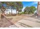 Expansive backyard featuring a spacious lawn, mature trees, and a charming patio area, perfect for outdoor entertaining at 11976 E Arizona Dr, Aurora, CO 80012