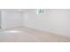 A large basement with neutral tile flooring is illuminated by a small window providing natural light at 11976 E Arizona Dr, Aurora, CO 80012