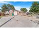 Charming single-story brick home with a well-maintained lawn, driveway, and attached garage in a desirable neighborhood at 11976 E Arizona Dr, Aurora, CO 80012
