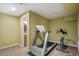 Basement workout area featuring a treadmill and stationary bike at 9451 S Hackberry Ln, Highlands Ranch, CO 80129