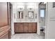 Shared bathroom with double vanity and updated finishes at 6056 S Coventry E Ln, Littleton, CO 80123