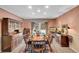 Formal dining room with hardwood floors and large windows at 6056 S Coventry E Ln, Littleton, CO 80123