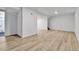 Spacious basement with light wood flooring, white walls, and ample lighting at 12801 Randolph Pl, Denver, CO 80239