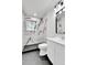 Modern bathroom features marble tile shower, updated vanity, and black framed mirror at 12801 Randolph Pl, Denver, CO 80239