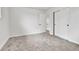 Well-lit bedroom boasts gray carpeting, large closet with sliding doors, and a white trim at 12801 Randolph Pl, Denver, CO 80239