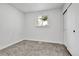 A bright and clean bedroom with neutral carpeting, fresh paint and ample closet space at 12801 Randolph Pl, Denver, CO 80239