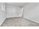 Well-lit bedroom boasts gray carpeting, large closet with sliding doors, and a white trim at 12801 Randolph Pl, Denver, CO 80239