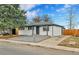 A lovely home with a manicured gravel front yard and inviting curb appeal at 12801 Randolph Pl, Denver, CO 80239