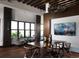 Sophisticated dining room featuring dark wood floors, modern chandelier, and a large landscape art piece at 2078 S Teller Ct, Lakewood, CO 80227