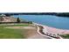Picturesque lake view featuring a beach, walking path, and stunning natural landscape at 2078 S Teller Ct, Lakewood, CO 80227