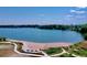 Beautiful lake view with a sandy beach, walking paths, and lush greenery at 2078 S Teller Ct, Lakewood, CO 80227