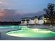 Stunning community pool area with ample lighting and a relaxing atmosphere at twilight at 2078 S Teller Ct, Lakewood, CO 80227