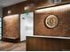 Elegant reception area with wood-paneled walls, modern lighting, and stylish decor at 2078 S Teller Ct, Lakewood, CO 80227