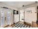 Cozy bedroom with french doors leading to a private patio and built-in shelving at 4418 Utica St, Denver, CO 80212