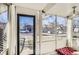 Cozy screened porch with view of the street and surrounding homes at 4418 Utica St, Denver, CO 80212