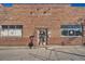 Brick storefront building with large windows at 4418 Utica St, Denver, CO 80212