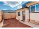 The inviting backyard features a wood fence, new mulch, and convenient access to the back entrance at 4835 Grove St, Denver, CO 80221
