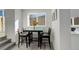 Charming dining area with a four-chair table, perfect for intimate meals and gatherings at 4835 Grove St, Denver, CO 80221