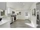Bright kitchen with stainless steel appliances, modern countertops, and ample cabinet space at 4835 Grove St, Denver, CO 80221