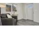 Cozy living room showcases a comfortable armchair, decorative details, and abundant natural light at 4835 Grove St, Denver, CO 80221