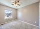 Well-lit bedroom with neutral walls, carpet, and window view at 8448 W Union Ave # 9, Littleton, CO 80123