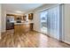 Kitchen with stainless steel appliances, wood cabinets and access to patio at 8448 W Union Ave # 9, Littleton, CO 80123