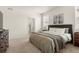 Bright bedroom with ensuite bathroom, featuring a queen-sized bed and contemporary decor at 2326 Monte Vista St, Fort Lupton, CO 80621
