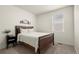 Modern bedroom featuring neutral tones, a minimalist design and stylish décor at 2326 Monte Vista St, Fort Lupton, CO 80621