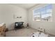 Bedroom with a changing table, play mat, and views of a neighborhood at 2326 Monte Vista St, Fort Lupton, CO 80621
