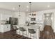 Bright kitchen features stainless appliances, granite counters, and a convenient island with barstool seating at 2326 Monte Vista St, Fort Lupton, CO 80621