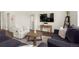 Comfortable living room setup featuring an entertainment center, plush seating, and stylish decor at 2326 Monte Vista St, Fort Lupton, CO 80621