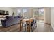 Inviting living space with a dining area, comfortable sofa, and sliding glass door to the backyard at 2326 Monte Vista St, Fort Lupton, CO 80621