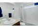 Clean bathroom featuring a single vanity and shower tub combo at 25812 E Cedar Pl, Aurora, CO 80018