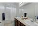 Bright bathroom featuring a double vanity and shower tub combo at 25812 E Cedar Pl, Aurora, CO 80018