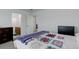 Comfortable bedroom with adjacent ensuite bathroom at 25812 E Cedar Pl, Aurora, CO 80018