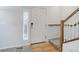 Inviting foyer with a front door, stairwell and wood accents at 25812 E Cedar Pl, Aurora, CO 80018