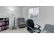 Office space with a window and bookshelves at 25812 E Cedar Pl, Aurora, CO 80018