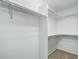 Spacious walk-in closet features built in shelving at 25812 E Cedar Pl, Aurora, CO 80018