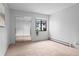 Comfortable bedroom with mirrored closet doors and a bright window for natural light at 532 Oakwood Dr # D103, Castle Rock, CO 80104