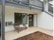 Inviting condo entrance with a charming wicker bench, perfect for enjoying the outdoors at 532 Oakwood Dr # D103, Castle Rock, CO 80104