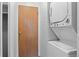 Laundry area featuring a stackable washer and dryer, alongside a closet at 532 Oakwood Dr # D103, Castle Rock, CO 80104