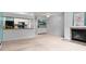 Inviting living space with a fireplace, open layout, and serene views of the kitchen area at 532 Oakwood Dr # D103, Castle Rock, CO 80104