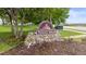 Stone Creek community entrance sign with stone base and lush landscaping at 532 Oakwood Dr # D103, Castle Rock, CO 80104