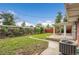 Inviting backyard featuring a well-maintained lawn, wooden fence, and covered patio area at 1330 Quari St, Aurora, CO 80011