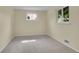 Bright bedroom with carpet, multiple windows and a neutral color palette at 1330 Quari St, Aurora, CO 80011