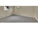Well-lit bedroom offering comfortable carpet, ample natural light, and neutral decor at 1330 Quari St, Aurora, CO 80011